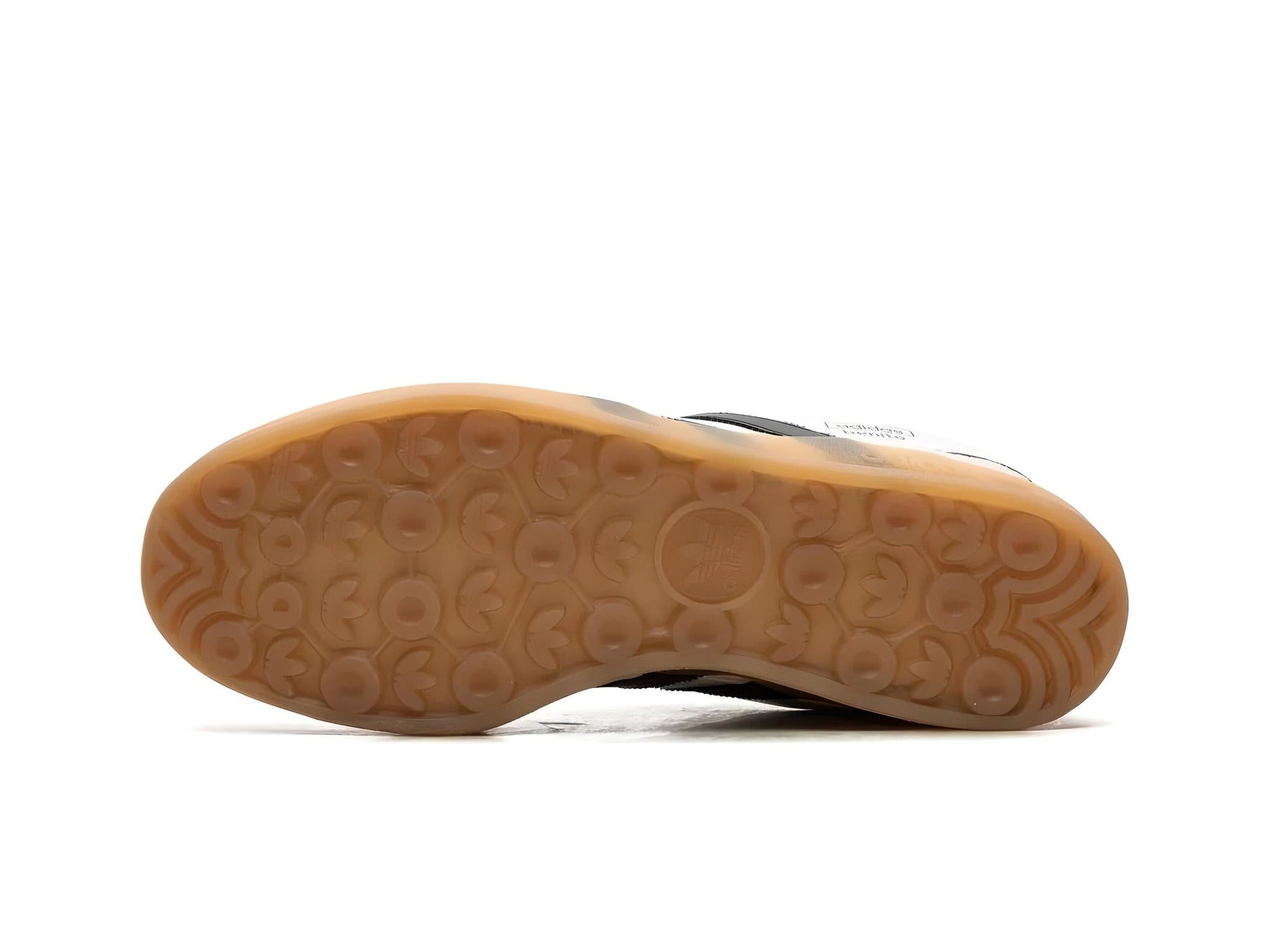 Bottom view of Adidas San Juan x Bad Bunny sneaker showing unique sole pattern.